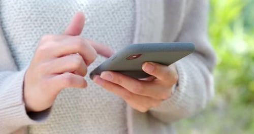 Close up of using mobile phone