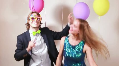 Cute couple dancing in photo booth