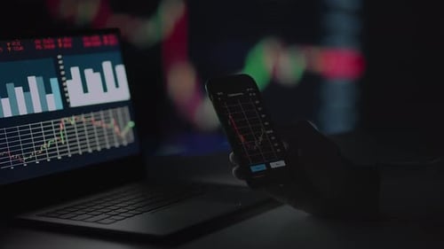 Investor Checking Stock Market Data On Screen Mobile Phone