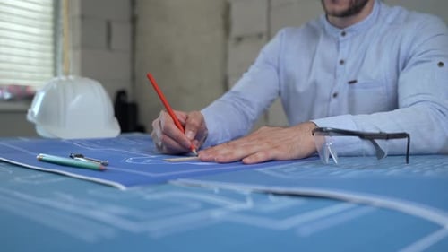 The architect working with building plan