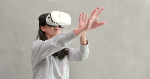Woman Experiencing Virtual Reality with VR Headset