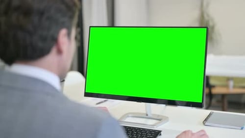 Businessman Using Desktop with Green Chroma Key Screen