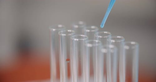 Clear Liquid Dropped into Test Tube With Pipette
