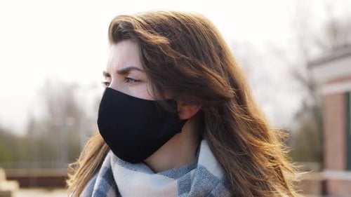 Woman Wearing Face Mask Looking At The Camera