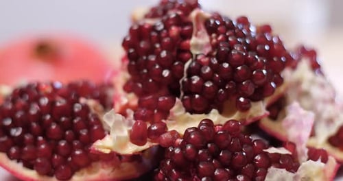 Cutting red pomegranate