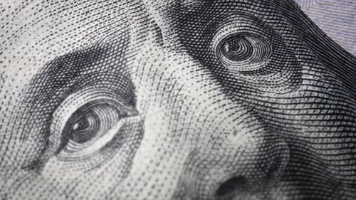 American one hundred dollar paper banknote in close up macro view dolly shot.