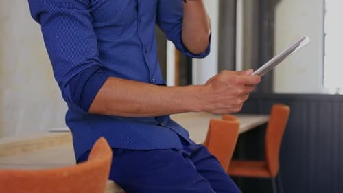 Businessman using digital tablet in modern office 4k
