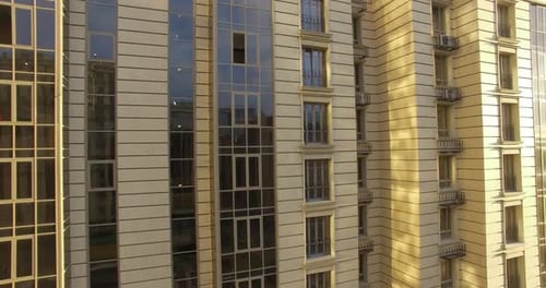 A Vertical Inspection of a Modern Building with a Beautiful Sunny Background
