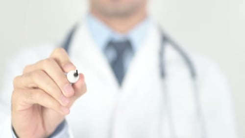 Doctor Writes Wellness With Marker on Glass