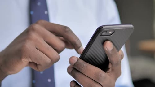 Close Up of Man Using Cell Phone