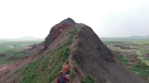 Couple Hiking on Rural Grassy Mountain Ridge