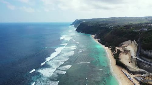 Aerial above sky of tropical coast beach break by blue green ocean and white sand background of a da