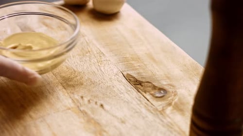 Close Up of Mustard in Bowl on Wood