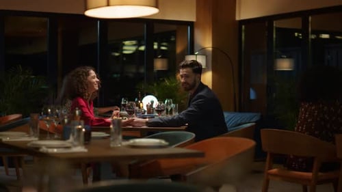 Mixed Race Couple Dating in Fancy Restaurant Table