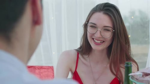 Woman Conversing at Table