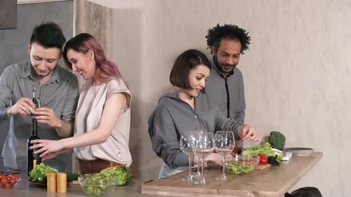 Friends Making Dinner Together in Modern Kitchen