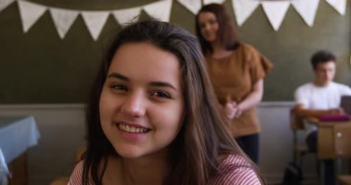 Portrait of teenage girl in a school classroom