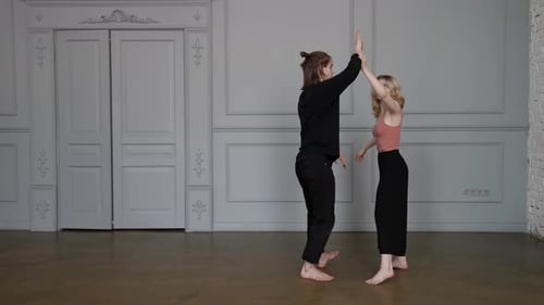 Professional Dancers are Rehearsing Contemporary Dance in Hall Young Man and Woman are Dancing