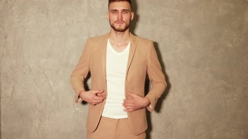 Fashionable Man Smiling in Suit Indoors