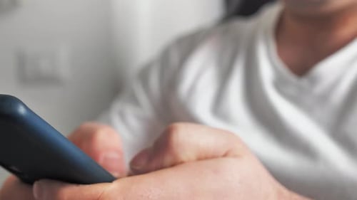 Close Up Of Hands Using a Mobile Phone
