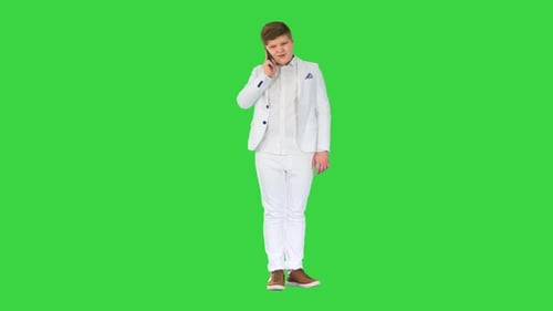 Businessman Boy Making a Call with Smartphone on a Green Screen Chroma Key