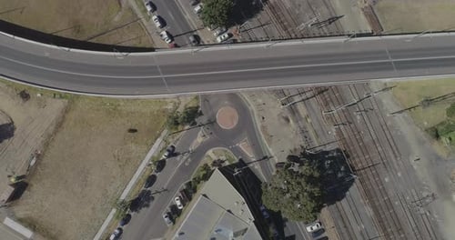Aerial View of Urban Intersection with Cars
