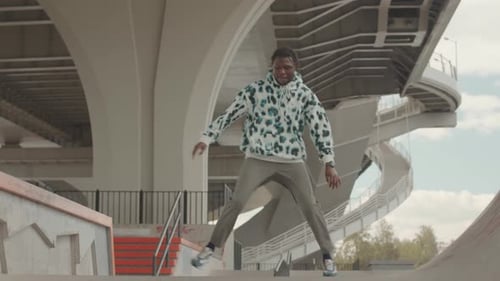 African American Guy Freestyle Dancing in Parking Lot