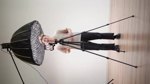 Blonde Young Adult Records Video On Phone