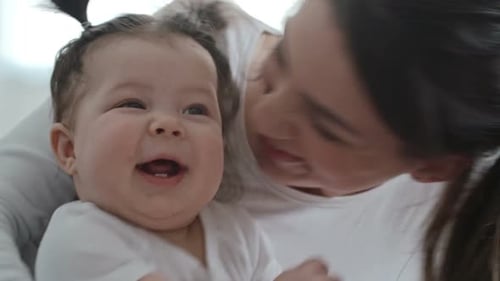 Happiest Mom Having Fun with Cute Baby