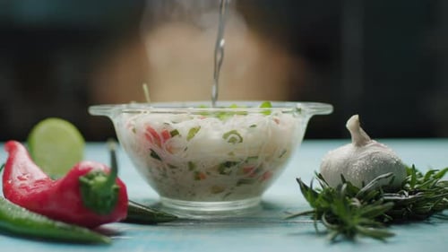 Rice Noodles Readying in Bowl on Blue Table