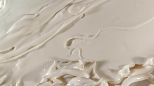 Close Up of White Cream Being Spread