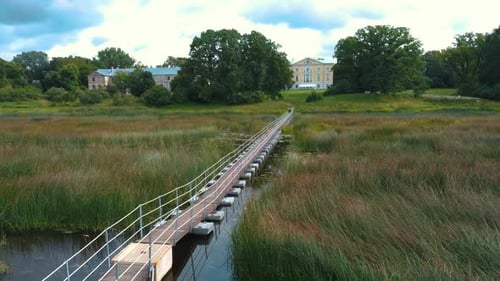 Mezotne Palace and Park Lielupe River With Ponton Bridge in the Background