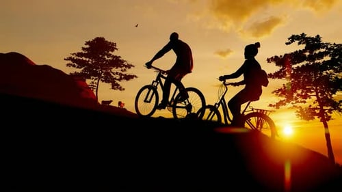 Young Bicycle Climbing Mountain at Sunset