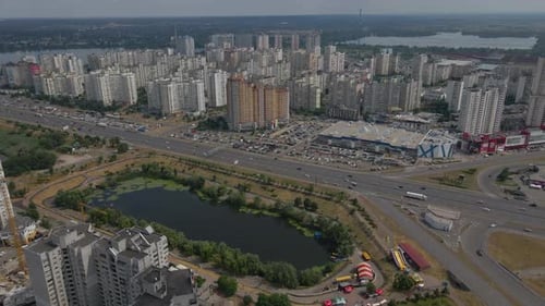 Aerial Footage of Kyiv Busy Streets and Tall Buildings Lake