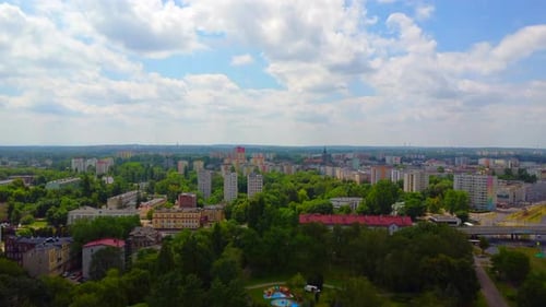 Aerial View of Cityscape with Green Trees