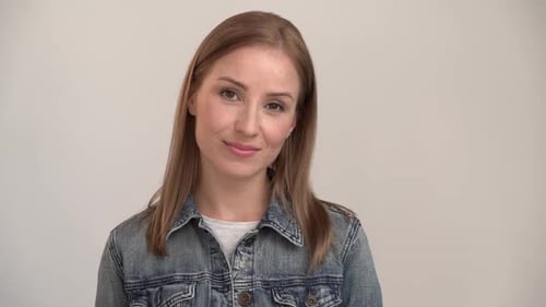 Smiling Woman in Denim Jacket Talking Portrait