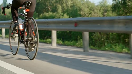 Female Cyclist Pedaling Bicycle