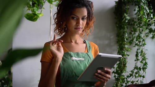 African Woman Hold Tablet in Hand and Work Spbd