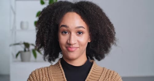 Smiling Woman Gives Thumbs Up Approval