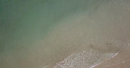 Beautiful beach with sea transparent clean water on both sides. Island concept travel destination.