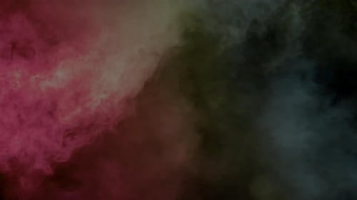 Colorful Smoke Spreading Across a Dark Background