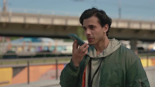 Man Using Smartphone in Urban Environment