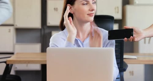 Stressed Woman Working at Laptop in Office