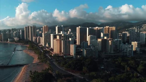 Aerial drone footage of Honolulu, Hawaii.
Beautiful real estate, buildings in the city.
Palm trees