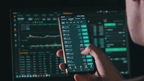 Person Scrolling Through Stock Data on Smartphone