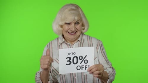 Senior Grandmother Showing Up To 30 Percent Off Inscription Signs, Rejoicing Discounts. Black Friday