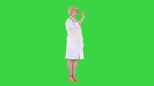 Mature Woman Doctor Interacting with Digital Display