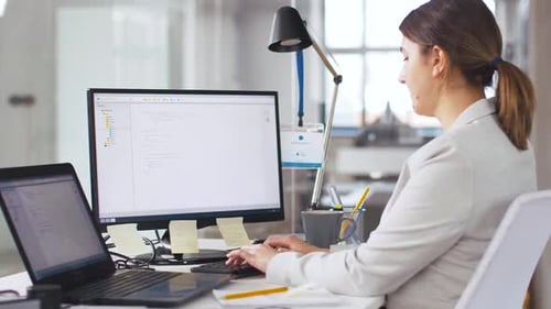 Female Programmer with Computer Working at Office 1