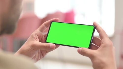 Holding Smartphone with Green Screen