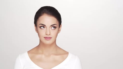 Studio portrait of young and beautiful brunette woman over